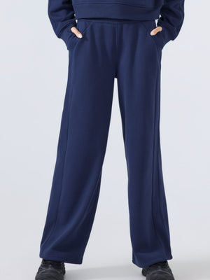 Dark blue relaxed palazzo sweatpants with drawstring waist and pockets.