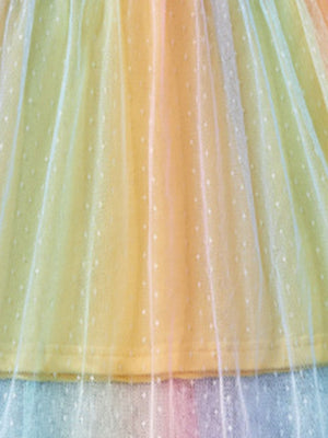 Toddler rainbow ombre tulle dress with white dot pattern.