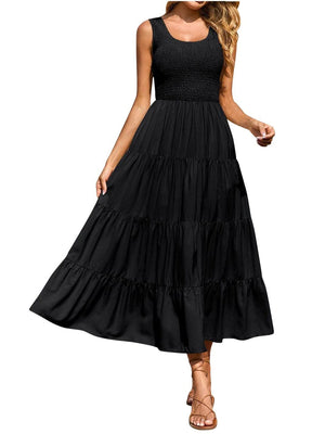 Black smocked bodice ruffled maxi dress with tiered skirt and scoop neck.