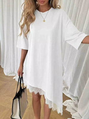 White asymmetrical t-shirt dress with lace trim detail and short sleeves.