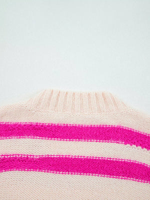 Cream and hot pink striped acrylic crew neck sweater with fuzzy texture.