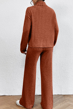 Ribbed knit turtleneck lounge set in rust, with long sleeves and wide-leg pants.