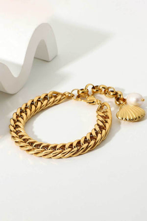 Gold chain bracelet with shell and pearl charms