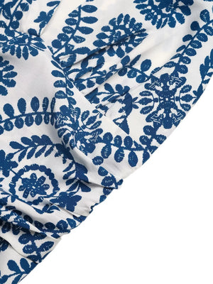 Blue and white medallion print halter maxi dress detail showing fabric texture and pattern.