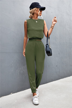 Army green cropped muscle tank and jogger set with padded shoulders and elastic waistband.