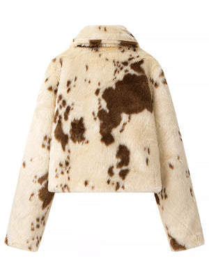 Cropped faux fur jacket in beige with brown cow print, collared, long sleeves.