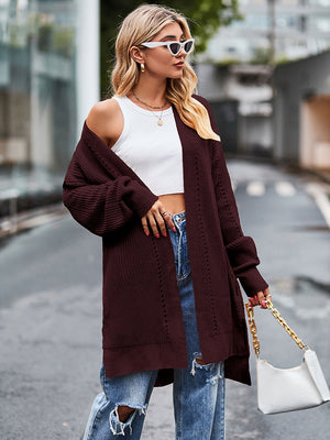 Open-stitch waffle knit duster cardigan in deep red with balloon sleeves.
