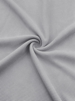 Light gray textured waffle knit fabric detail of joggers