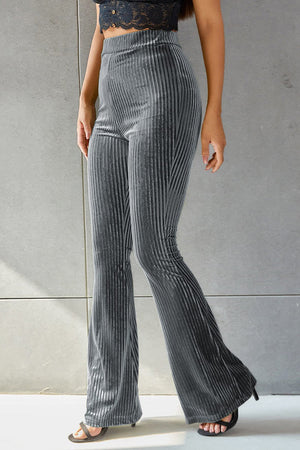 Ribbed velvet palazzo trousers in dark gray with a high waist and flared leg.