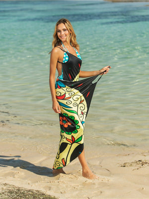 Owl graphic pareo wrap with black, yellow, and multicolor floral pattern.