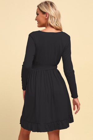 Black long sleeve wrap dress with ruffled hem and tie waist