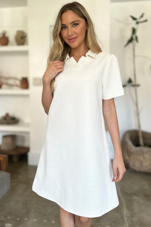 Ivory textured V-neck short sleeve mini dress with geometric pattern