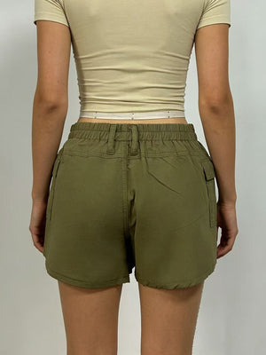 Green cargo shorts with pockets and elastic waistband