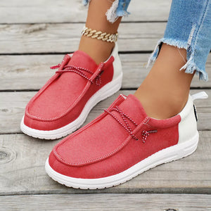 Red and white two-tone casual slip-on shoes with decorative laces and white soles.
