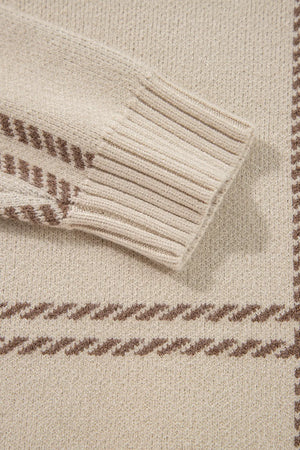 Tan knit crewneck pullover with brown gridline pattern and ribbed cuffs.