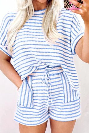 Light blue and white striped loungewear set with tie waist shorts and short sleeve top.