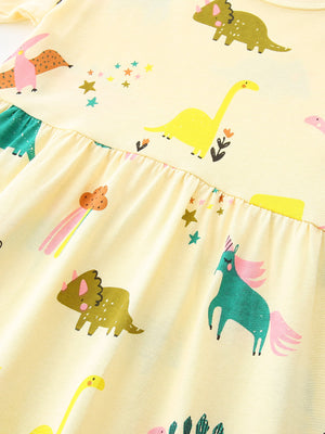 Yellow cotton toddler dress with whimsical dinosaur and unicorn print, ruffled waist detail.