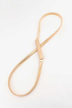 Gold-tone slimline metal waist belt with adjustable buckle and rectangular clasp.