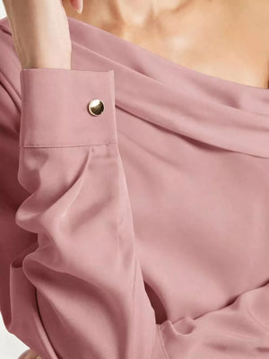 Elegant one-shoulder satin shirt in rose pink with a gold button cuff detail.