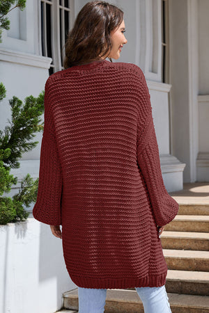 Textured knit cocoon cardigan in maroon with balloon sleeves.