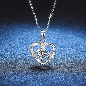 Silver heart pendant necklace with clear zircon and crystal accents.