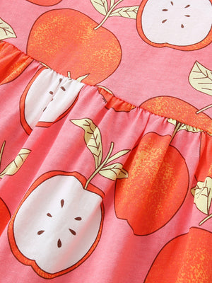Baby dress with playful apple print, ruffled waist, and short sleeves.