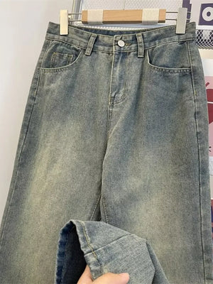 Classic plus size vintage wash jeans in medium blue denim with a relaxed fit.