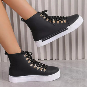 Black lace-up platform sneakers with D-ring eyelets and white soles.