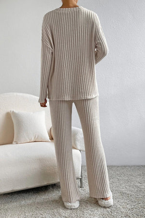 Cozy ribbed knit lounge set in camel, featuring a crewneck sweater and wide-leg pants.
