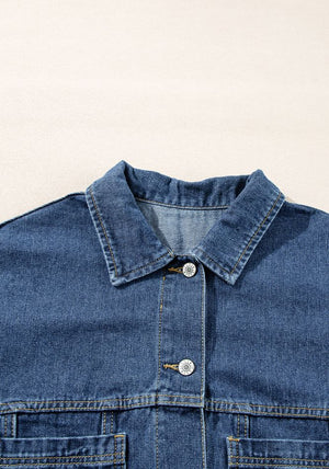 Oversized denim trucker jacket in medium blue wash with button closure and chest pockets.