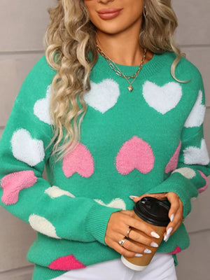 Green acrylic sweater with fuzzy heart pattern, crew neck, long sleeves.