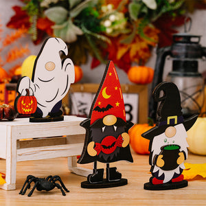 Halloween wooden gnomes and ghost figurine set with pumpkins and cauldron.