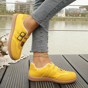 Yellow buckle strap Mary Jane inspired sneakers with double buckle detail and contrast stitching.