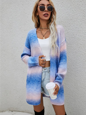 Rainbow gradient longline knit cardigan with open front, long sleeves, and a relaxed fit.