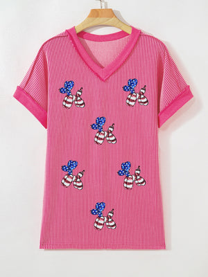 Pink striped V-neck tee with patriotic sequin balloon dog graphic and elastane blend.