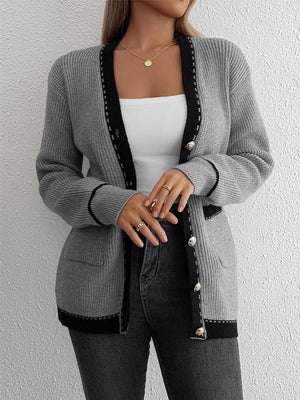 Gray knit cardigan with black contrast trim and gold buttons