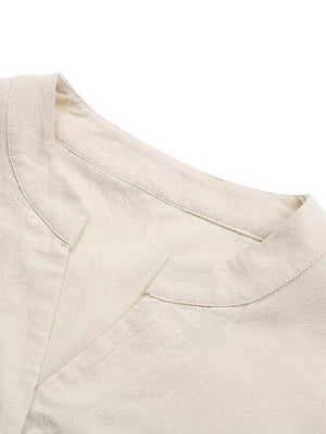 V-neck buttoned cotton mini dress in apricot with a subtle ruffle detail.