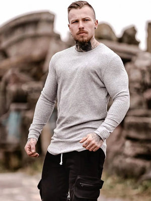 Light gray ribbed knit crewneck long sleeve muscle fit top with crew neckline.