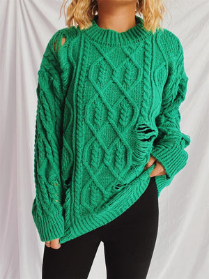 Green distressed cable knit sweater with ripped details and crew neck.