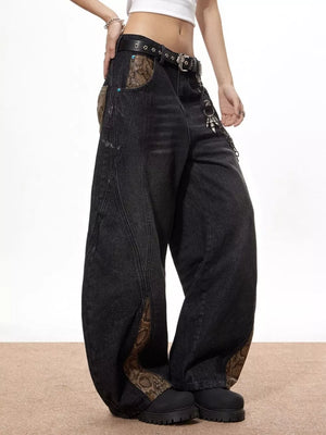 Vintage wide leg jeans in dark wash denim with snake print accents on pockets and side seams.