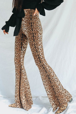 Leopard print bell bottom trousers with a flared leg, styled with a black top.