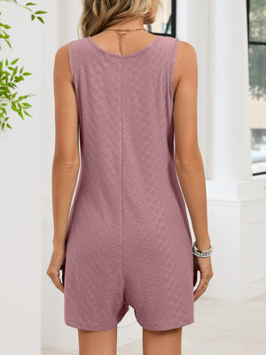Pink sleeveless romper with textured pattern and v-neckline