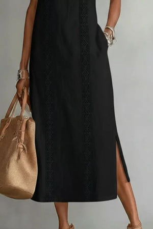 Black midi dress with pockets, lace trim detail, and side slit.