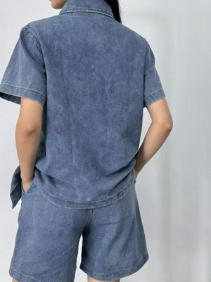 Button-up denim top and shorts set in dark blue, collared, short-sleeve, casual cotton.