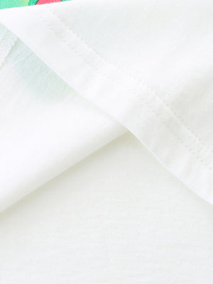 White cotton t-shirt detail showing seam and subtle butterfly print fabric.