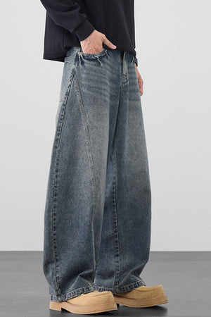 Men's oversized wide-leg jeans in medium wash denim, 100% cotton.