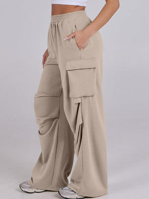 Tan cargo pocket sweatpants with wide legs and a relaxed fit.