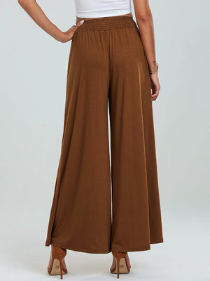 Elastic waist palazzo trousers in caramel with wide legs and pockets.