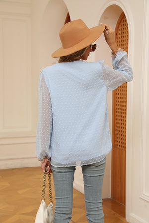 Misty Blue embroidered Swiss dot blouse with poet sleeves and ruffled cuffs.