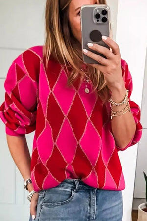 Vibrant argyle knit sweater with puff sleeves in deep rose and red, featuring a glitter thread detail.